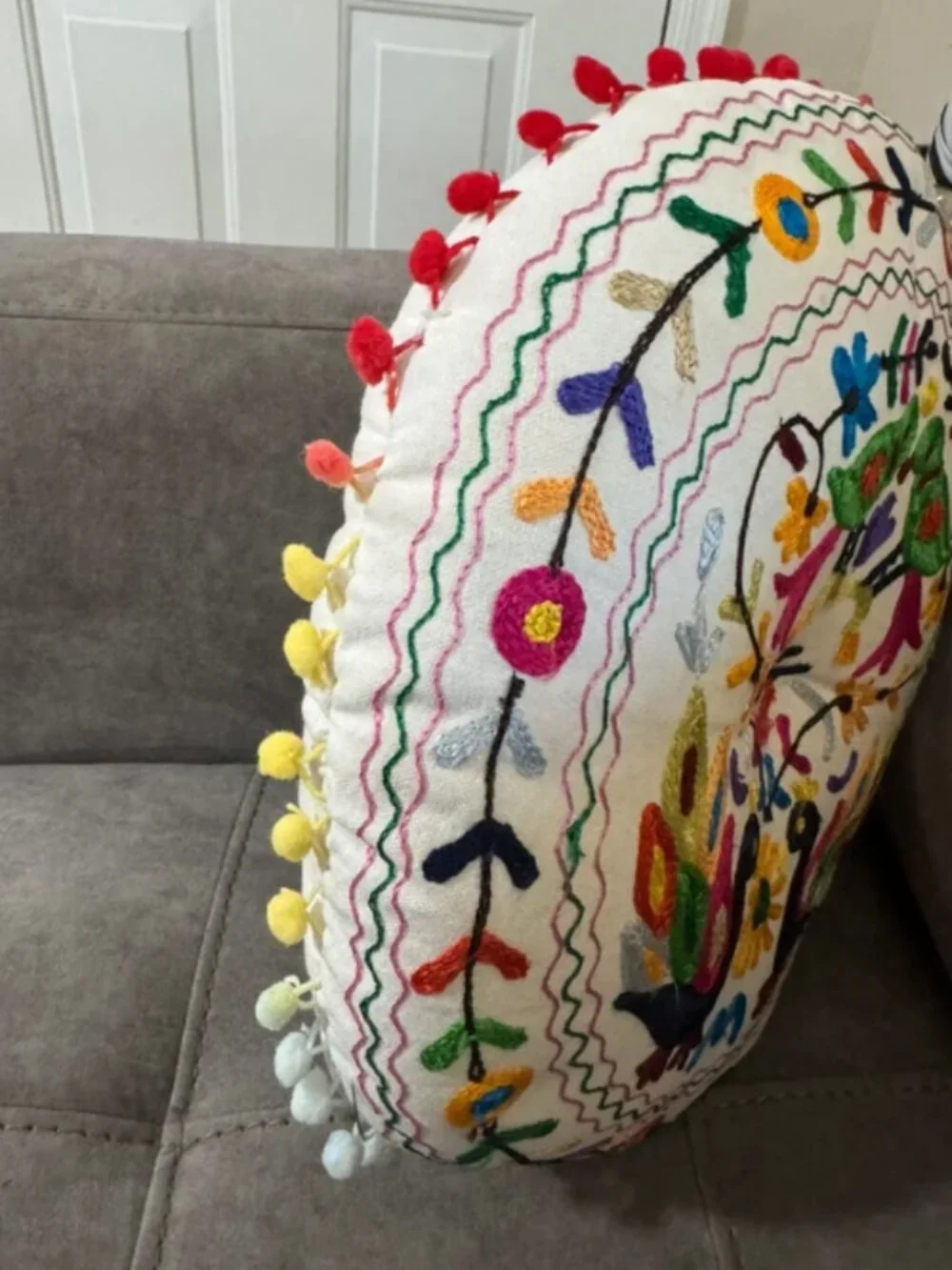 Embroidered round decorative pillow